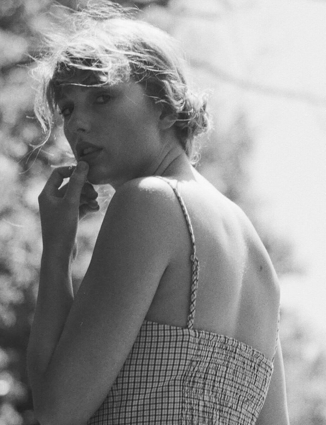Taylor Swift wearing a gingham sundress for her folklore album
