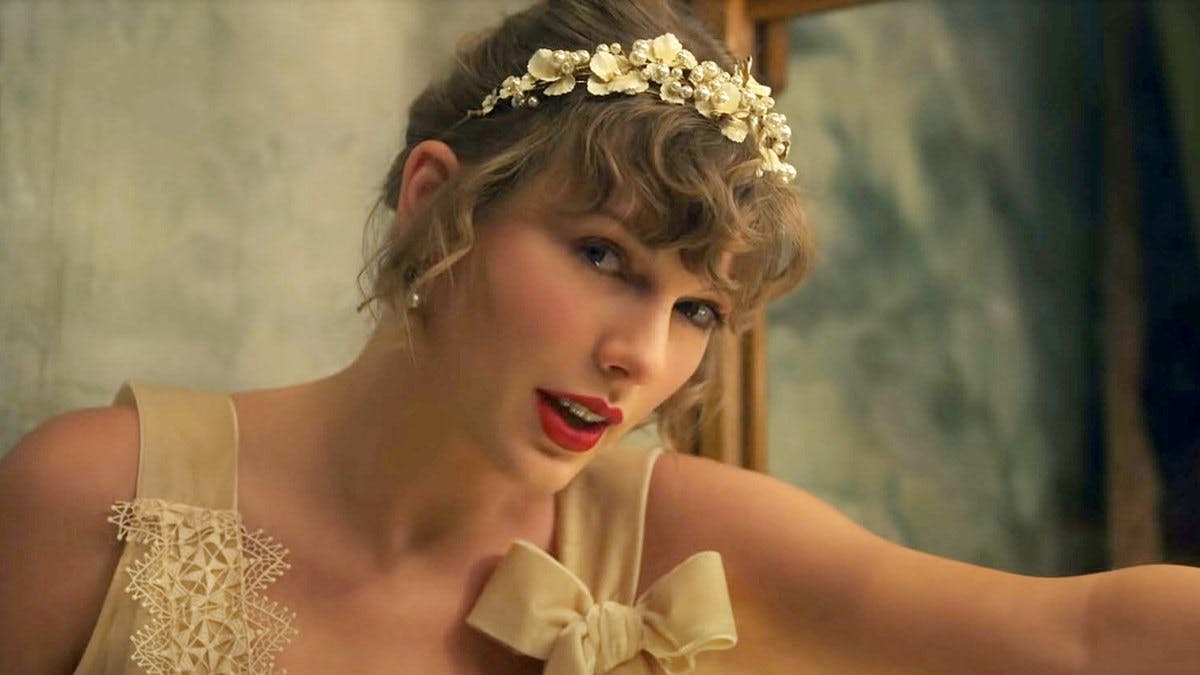 Taylor Swift in her music video for Willow wearing a floral headband