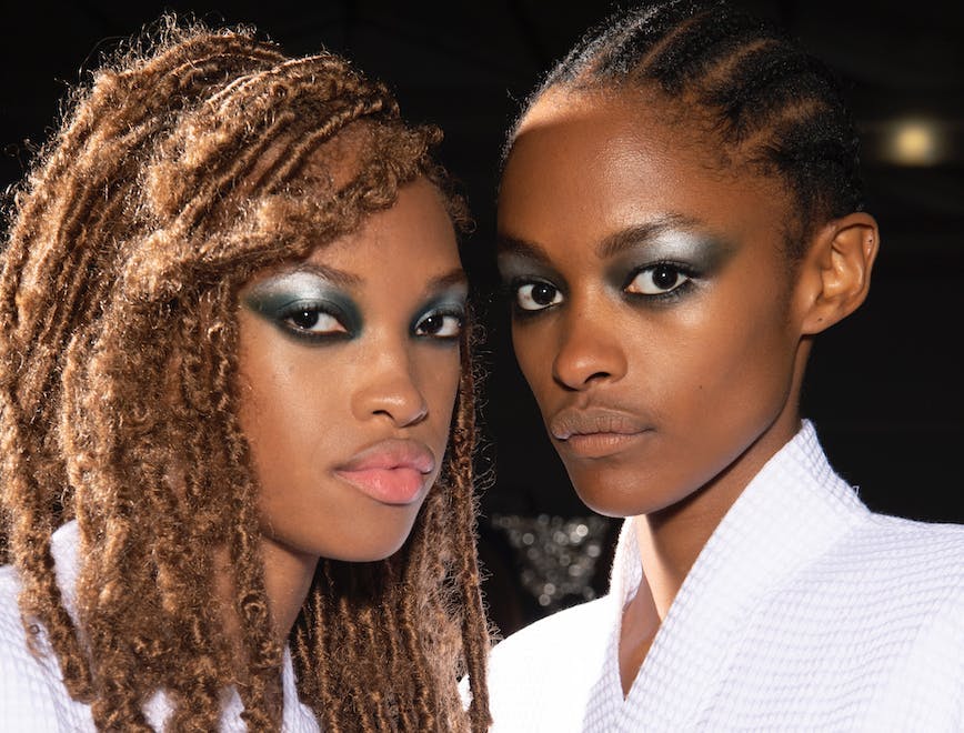 Models for Tommy Hilfiger wearing silver eyeshadow.