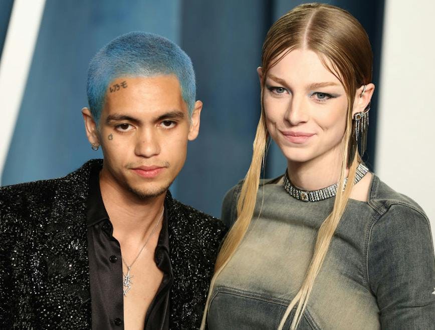 Dominic Fike and Hunter Schafer looking at the camera.