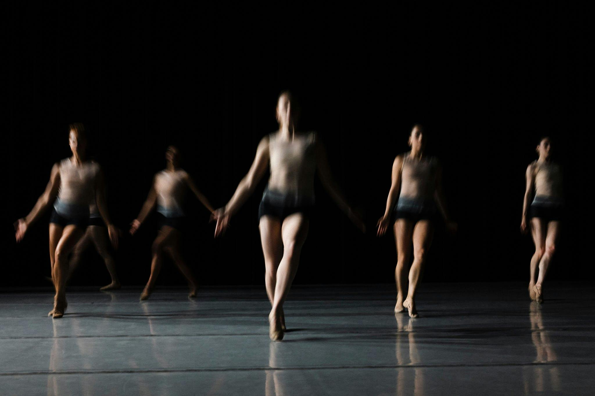 A group of dancers in a blurry image.
