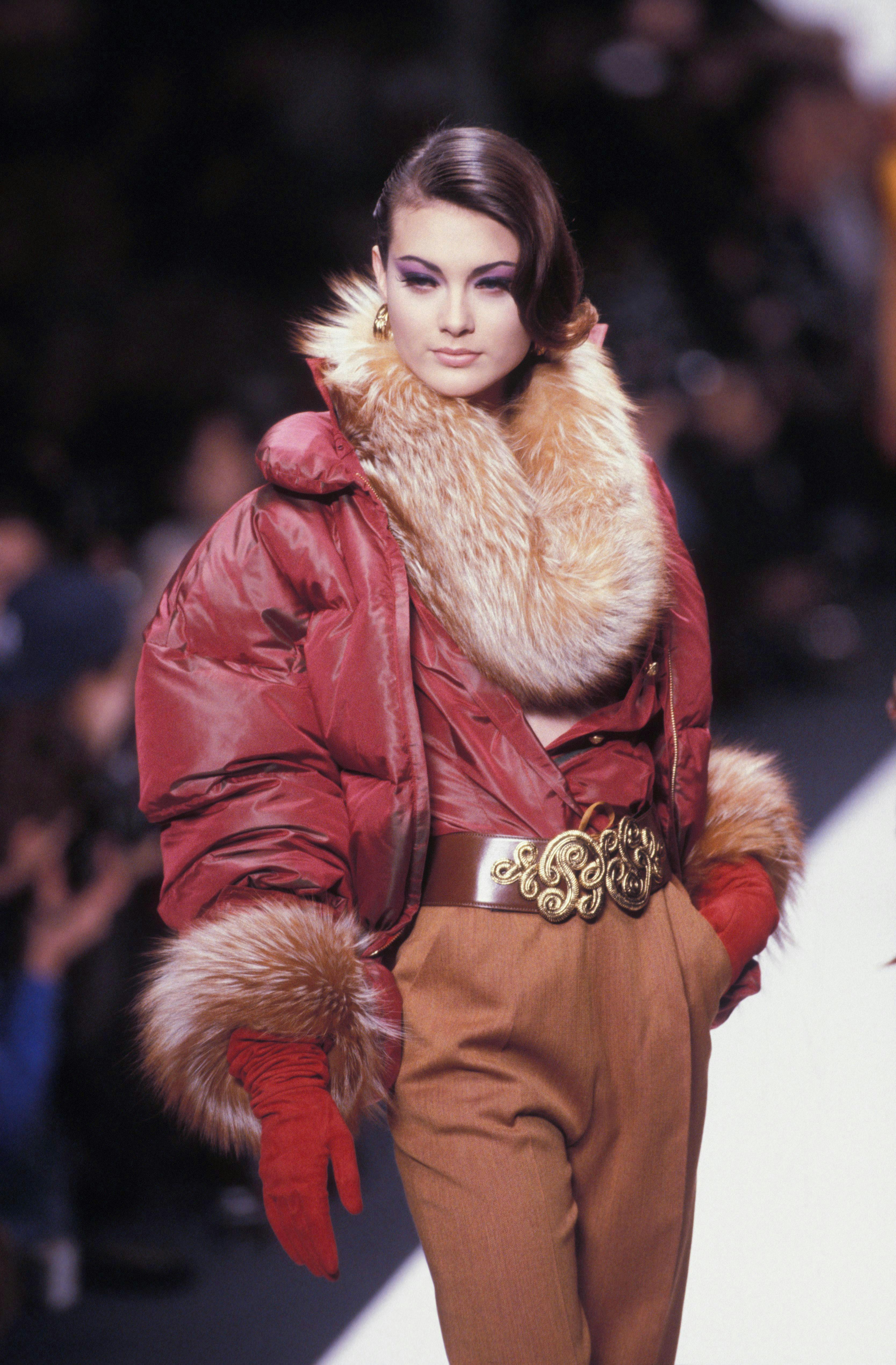paris fashion coat woman adult female person jacket face glove fur