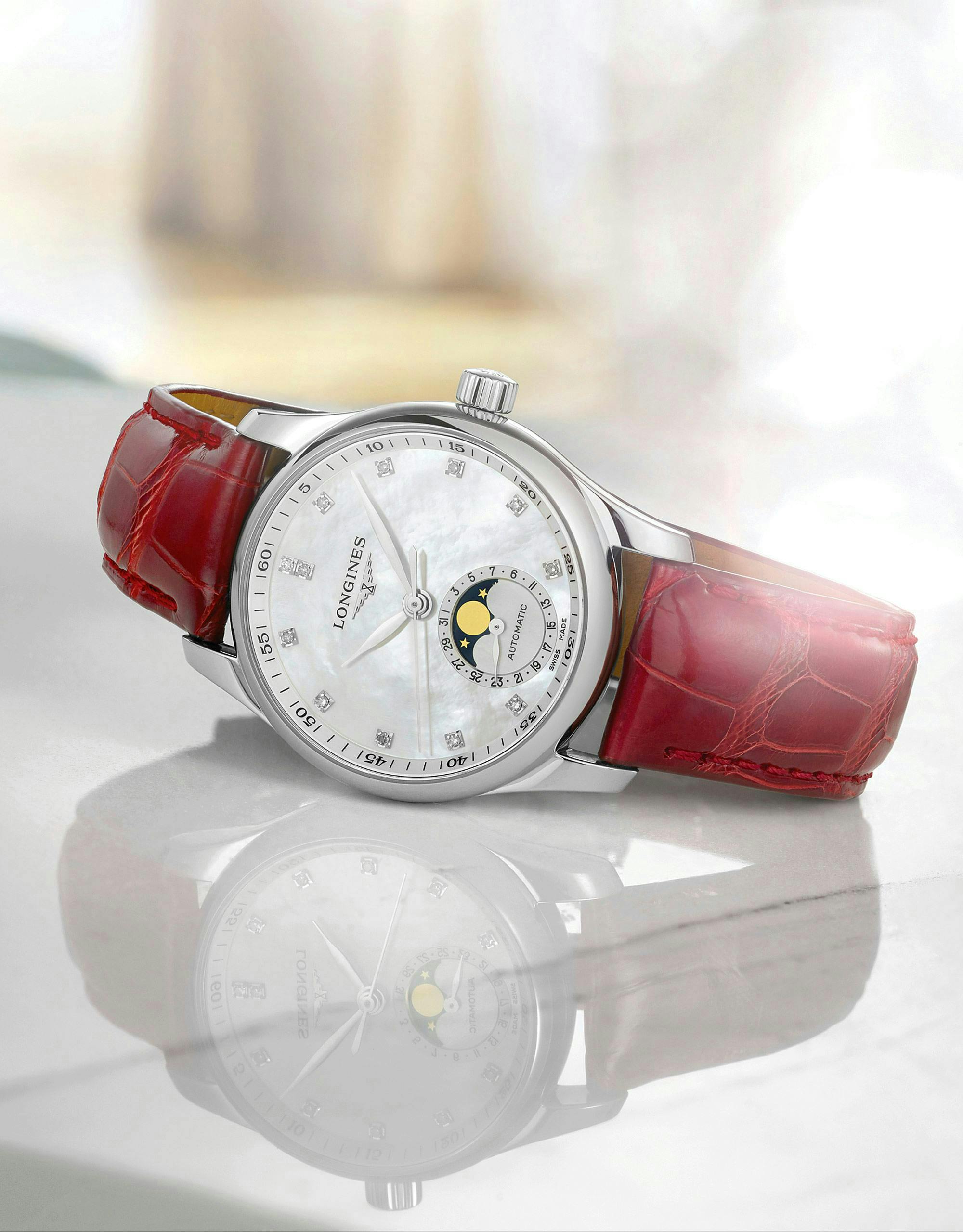 watch white face red band glassy counter
