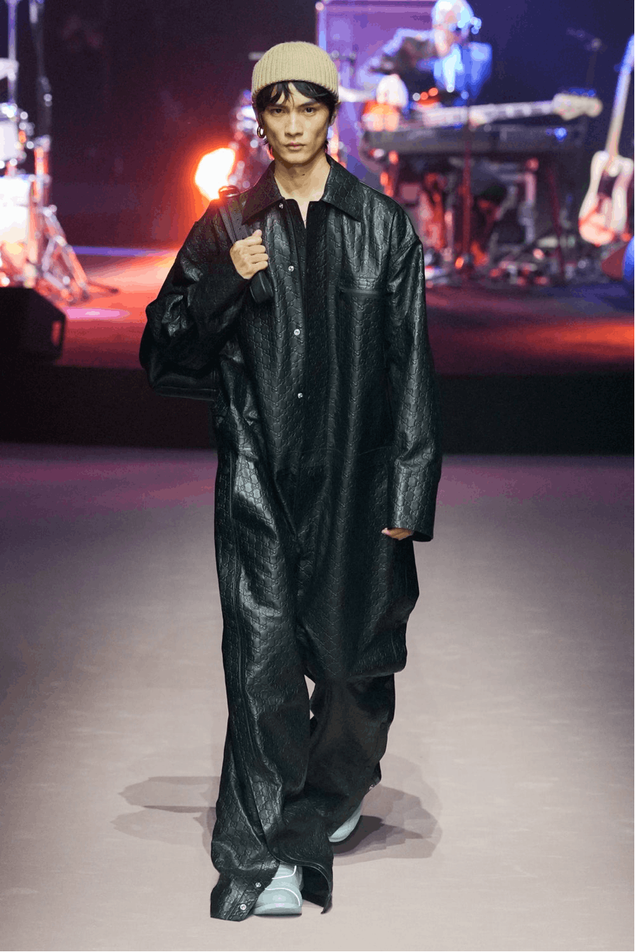 solo performance person performer man adult male coat standing guitar fashion