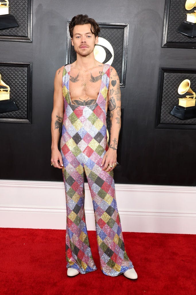A man in a rainbow jumpsuit.