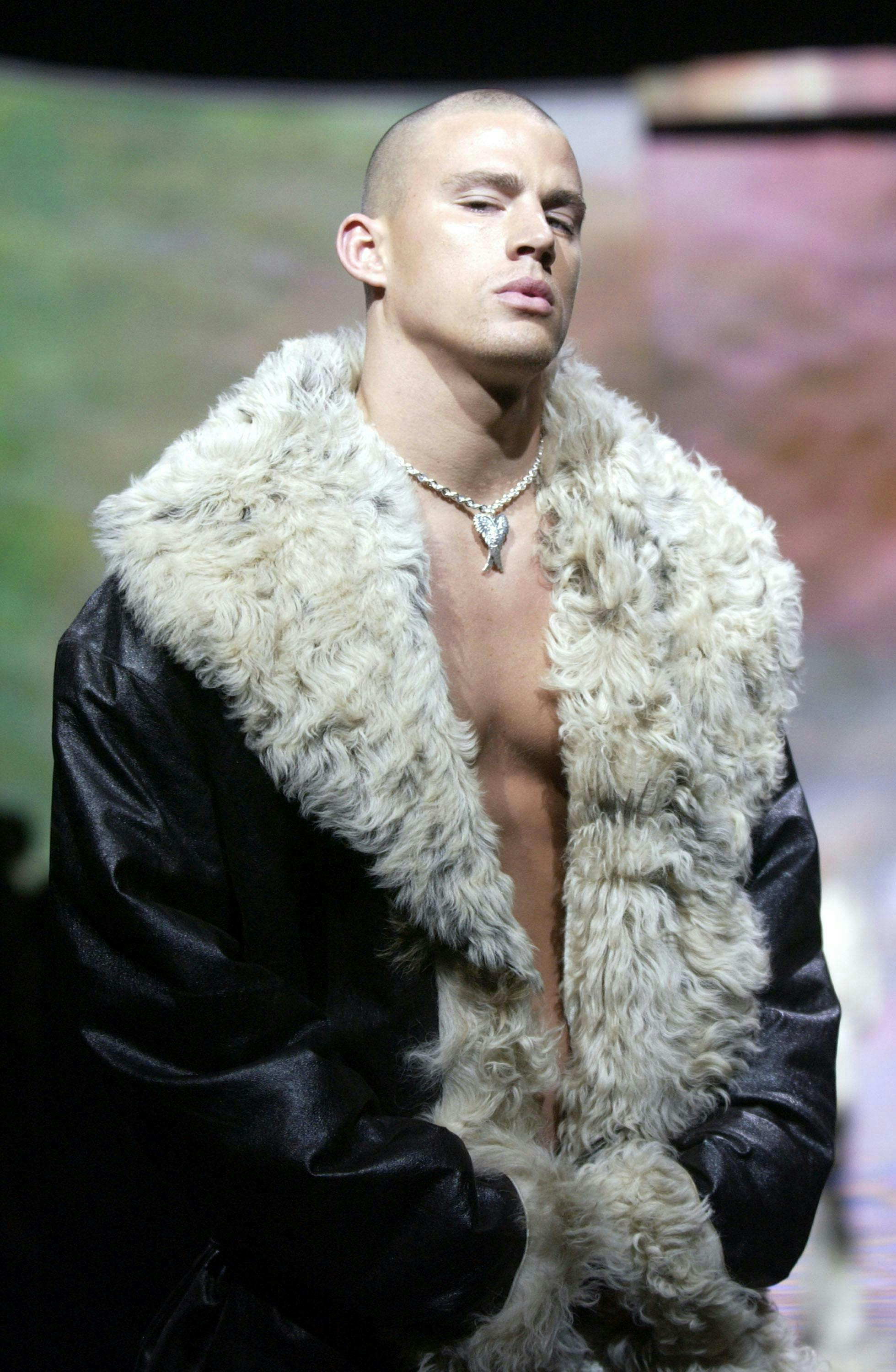 Channing Tatum wears black, leather coat with fur trim.