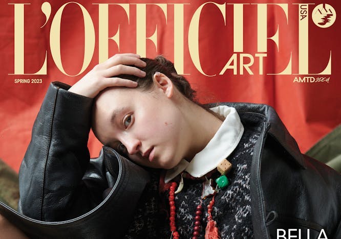 Bella Ramsey in a black jacket and sweater on the cover of L'Officiel