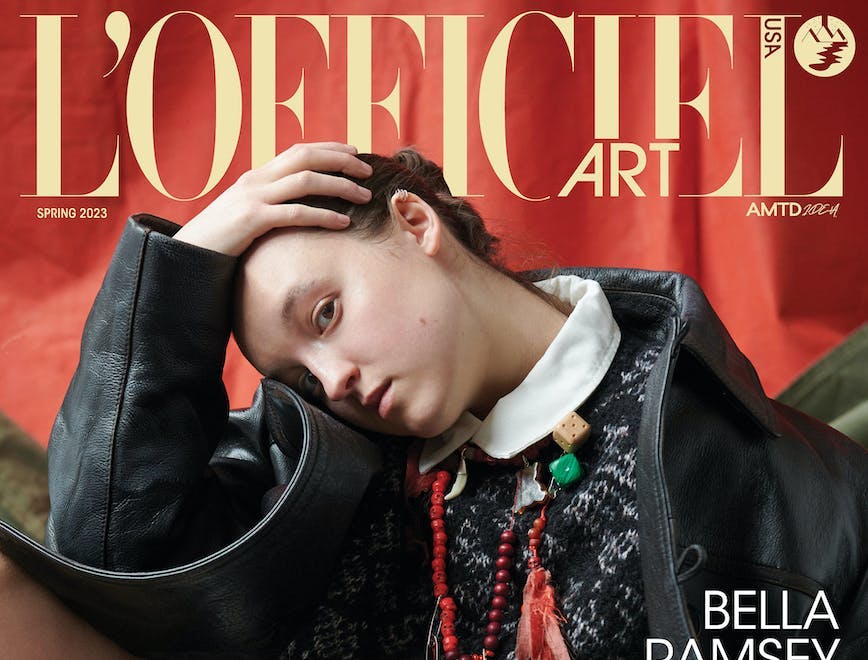 Bella Ramsey in a black jacket and sweater on the cover of L'Officiel