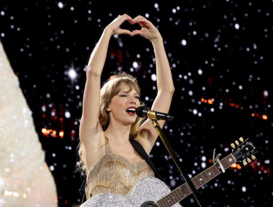 Taylor Swift performing on stage while on tour.