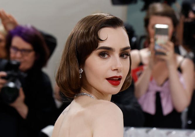 Lily Collins in a black and white gown.