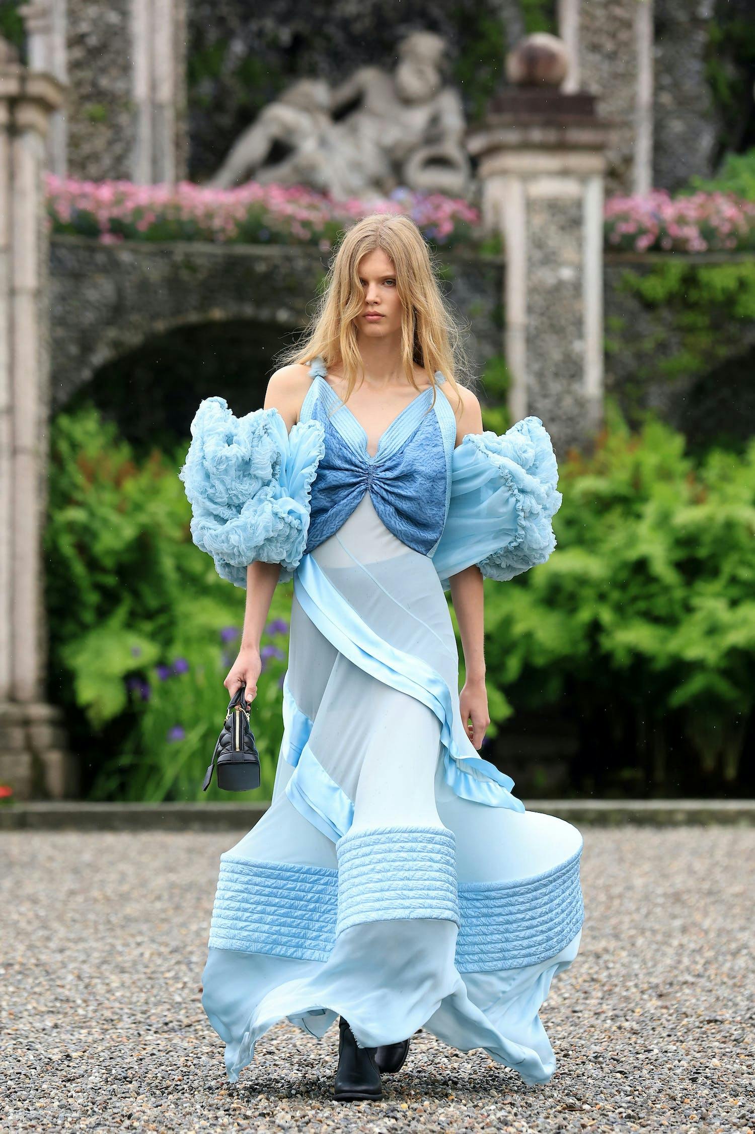 A model in a blue gown for Louis Vuitton.