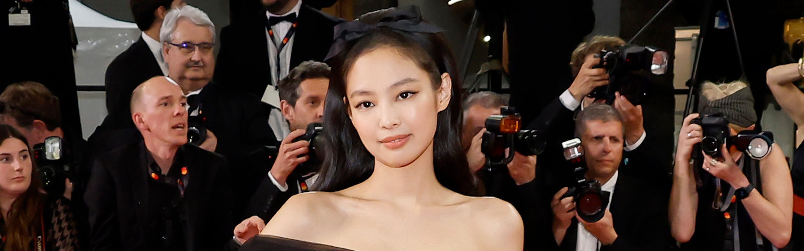 Jennie in a white and black dress at Cannes.