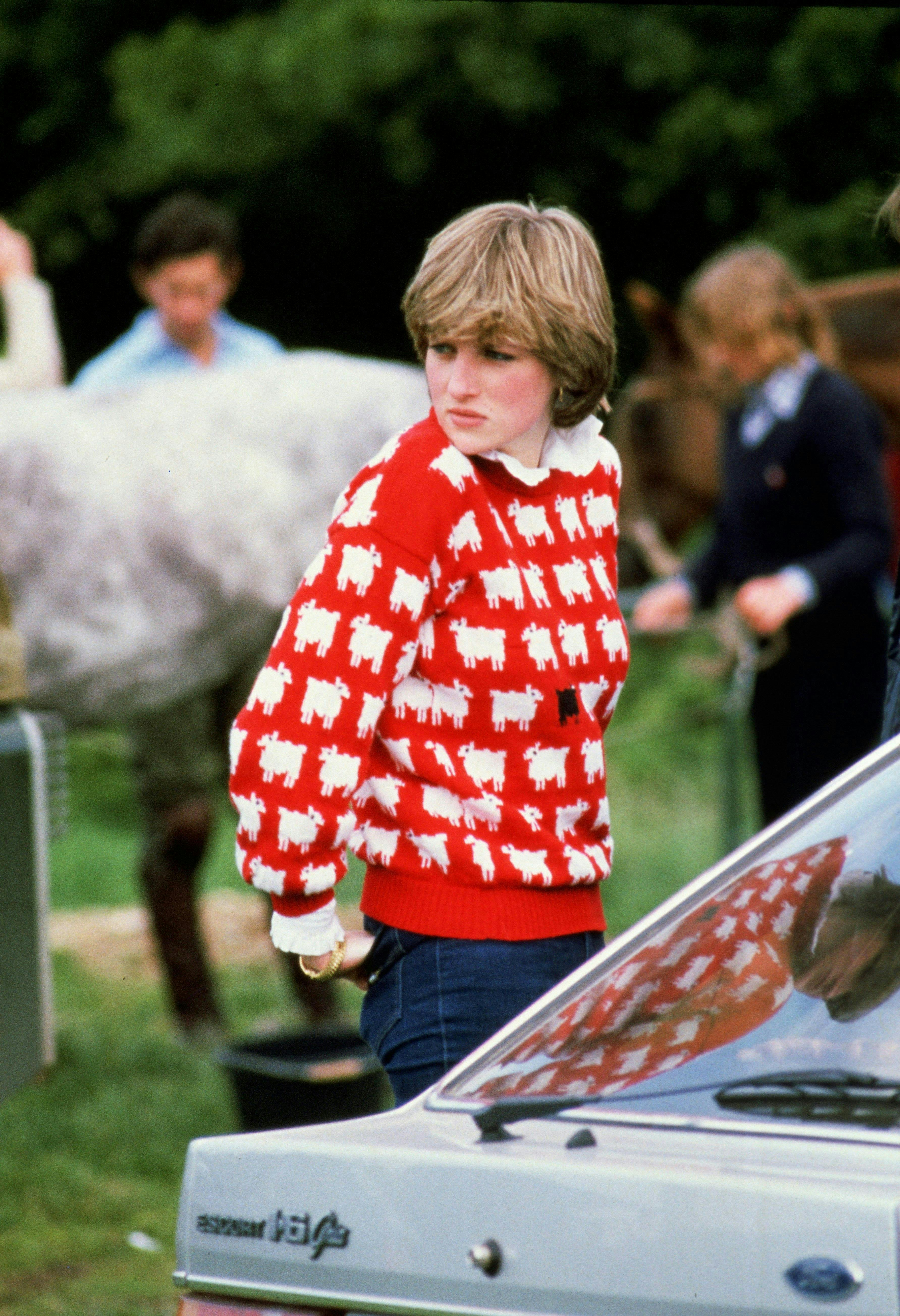 Princess Diana in a red sweater.