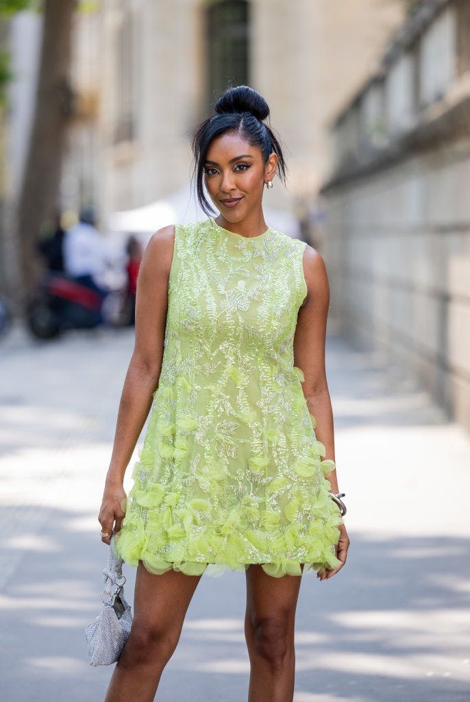 Tayshia Adams in a green mini dress.