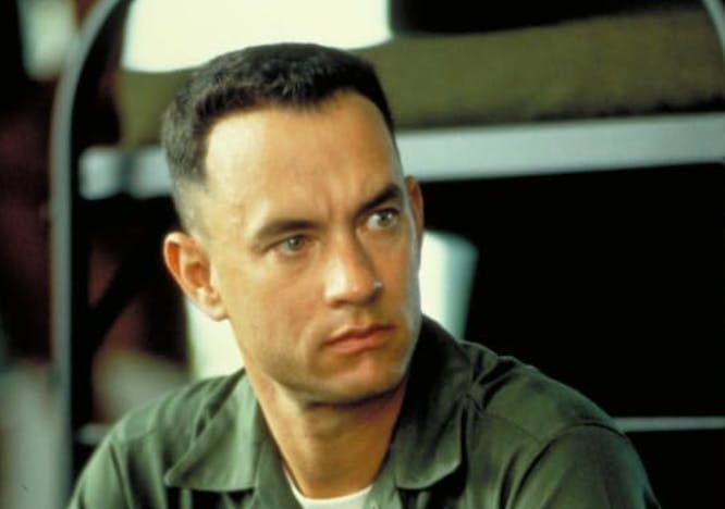 Tom hanks sitting in a green jumpsuit; best movie roles.