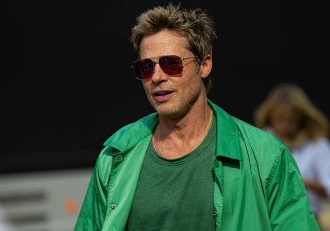 Brad Pitt in a green jacket and shirt celebrities at F1 British Grand Prix 2023