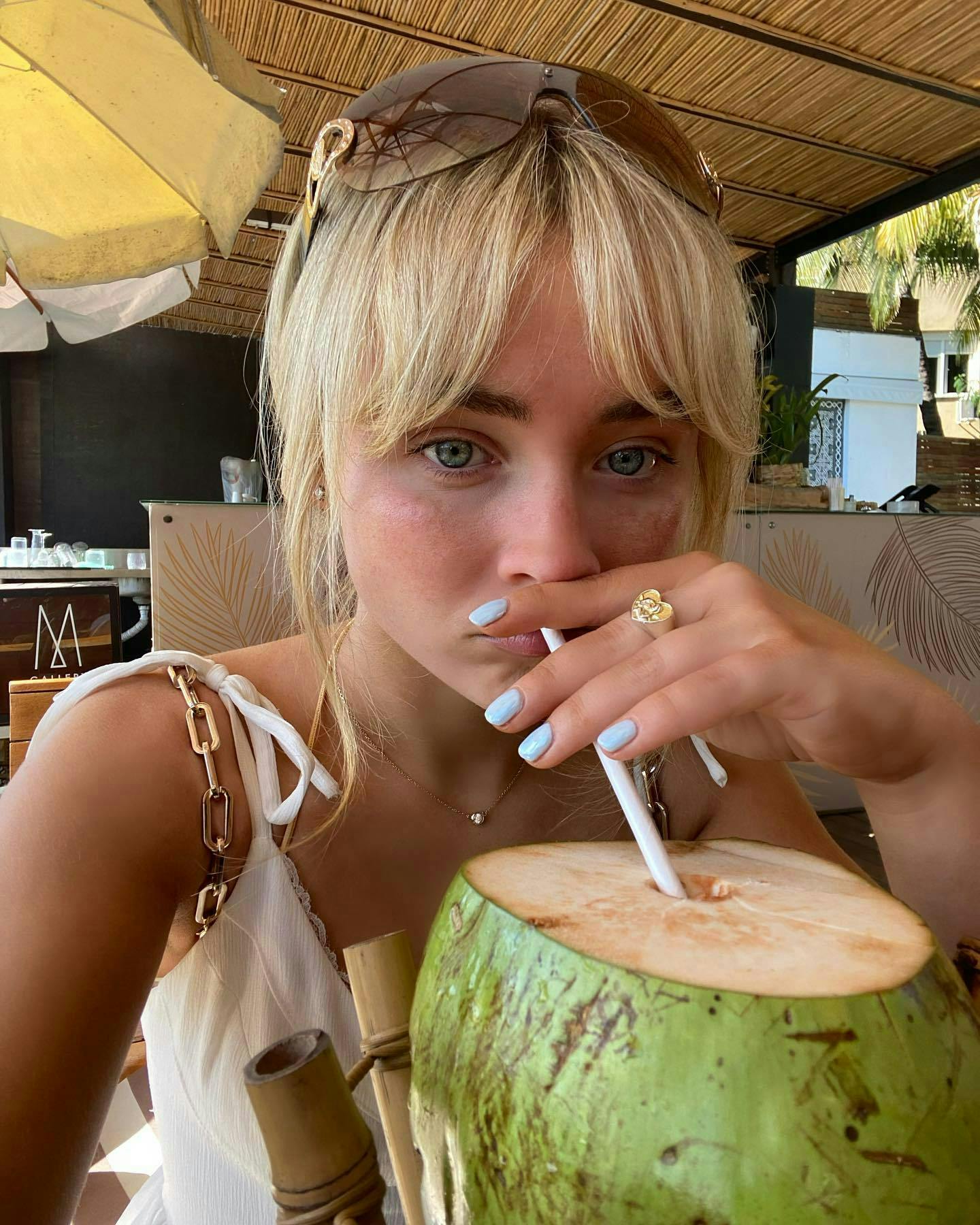 Milk nails; Summer nail trend 2023; Sabrina Carptenter in Brazil with blueberry milk nails.