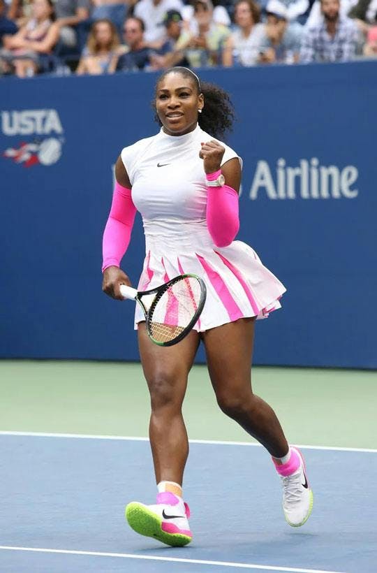 serena williams in white and pink tennis outfit