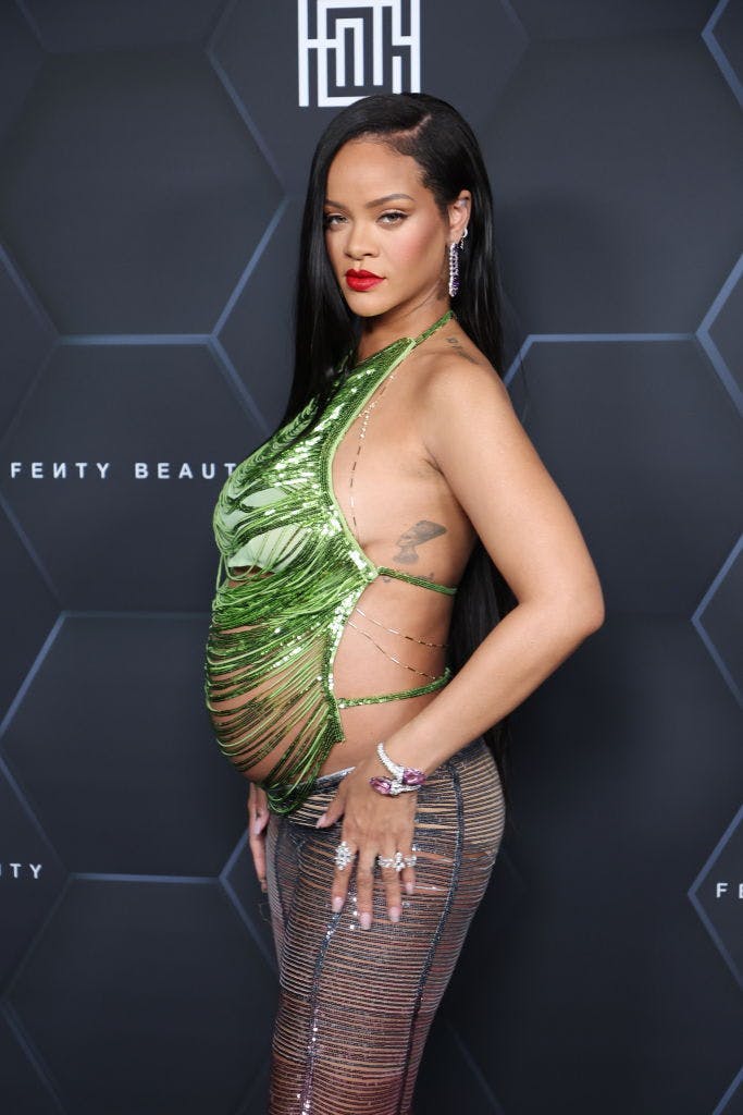 rihanna in green top and sheer pants; savage fenty maternity line