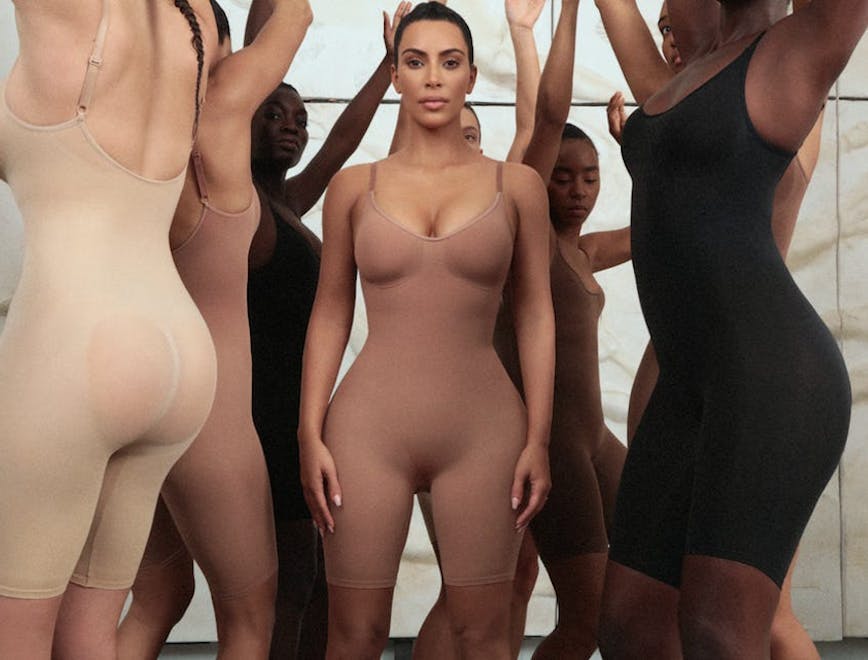 kim kardashian and models in skims shapewear; national shapewear day