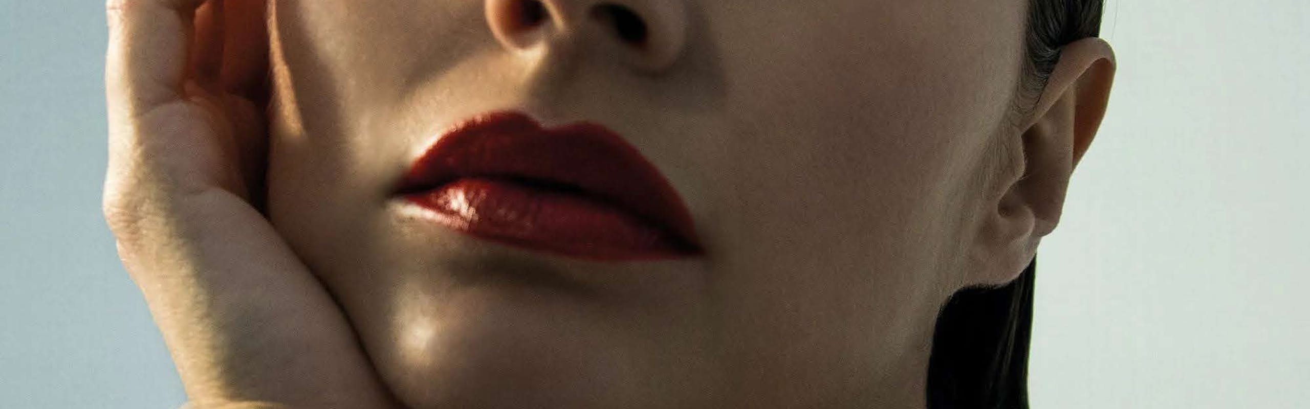 model in red lipstick; national lipstick day
