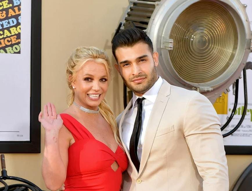 britney spears in red dress and sam asghari in suit; britney spears prenup