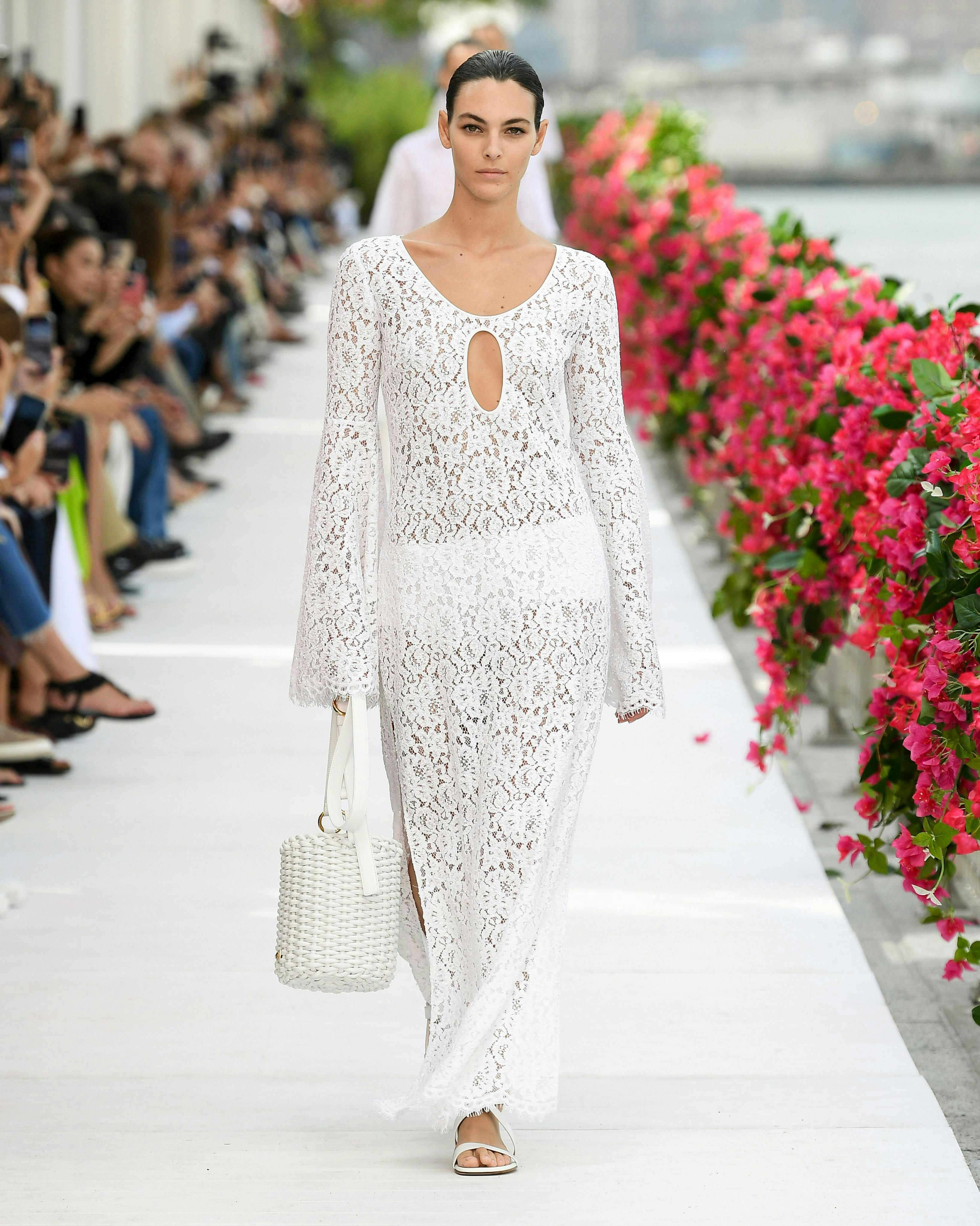 model in white lace gown