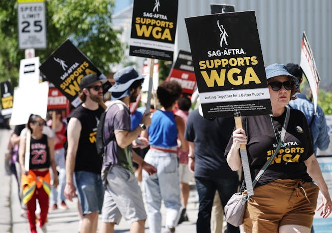 a group of writers and actors on strike
