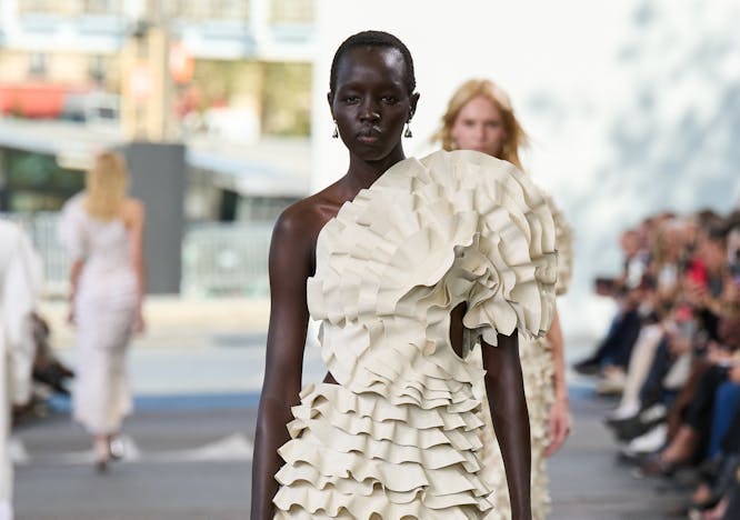 model in white sculpted maxi dress