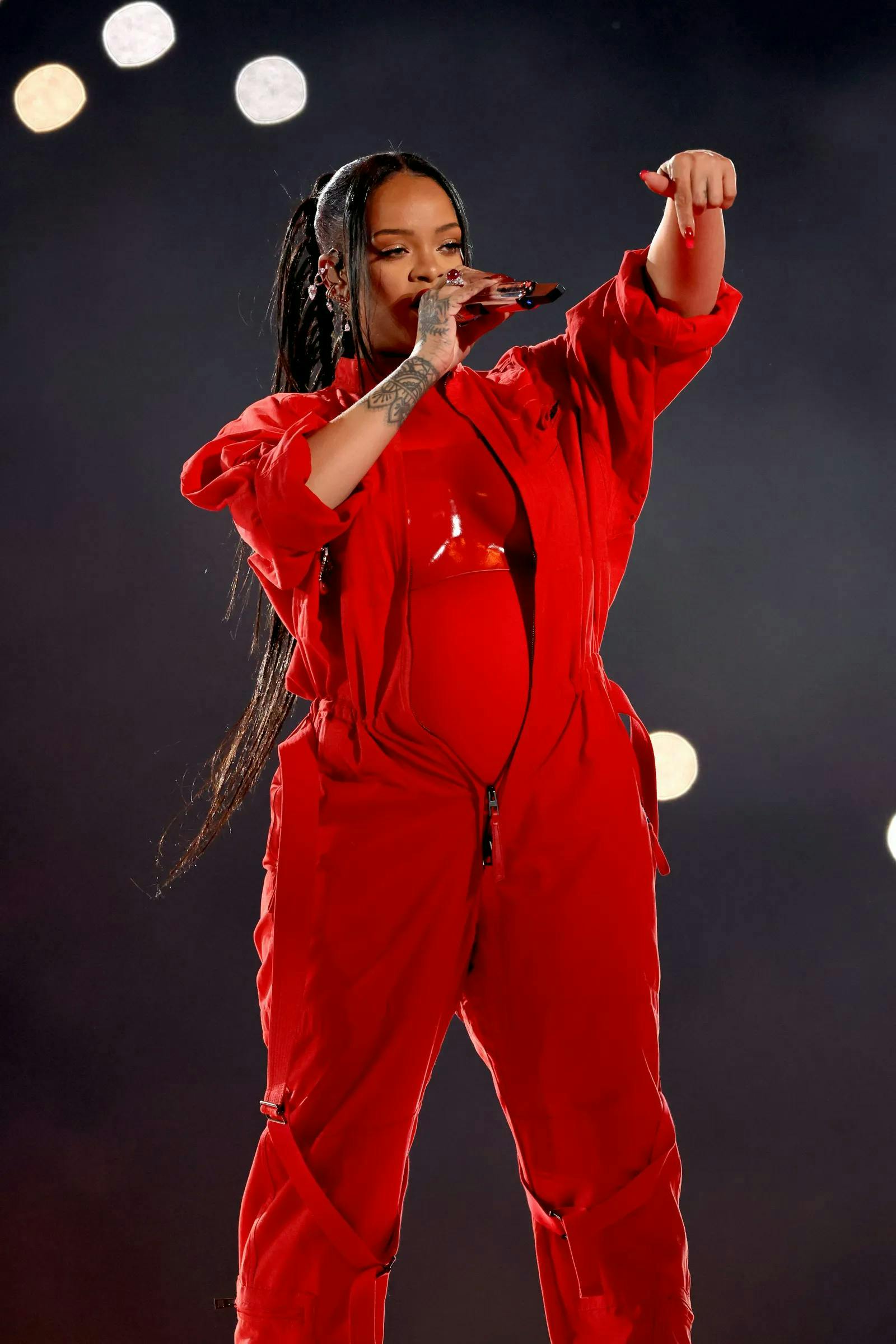 rihanna in a red jumpsuit and bustier