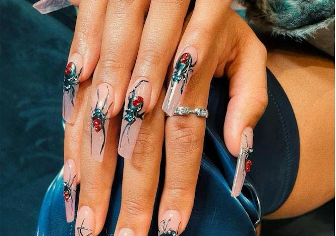 megan thee stallion nails showing spiders
