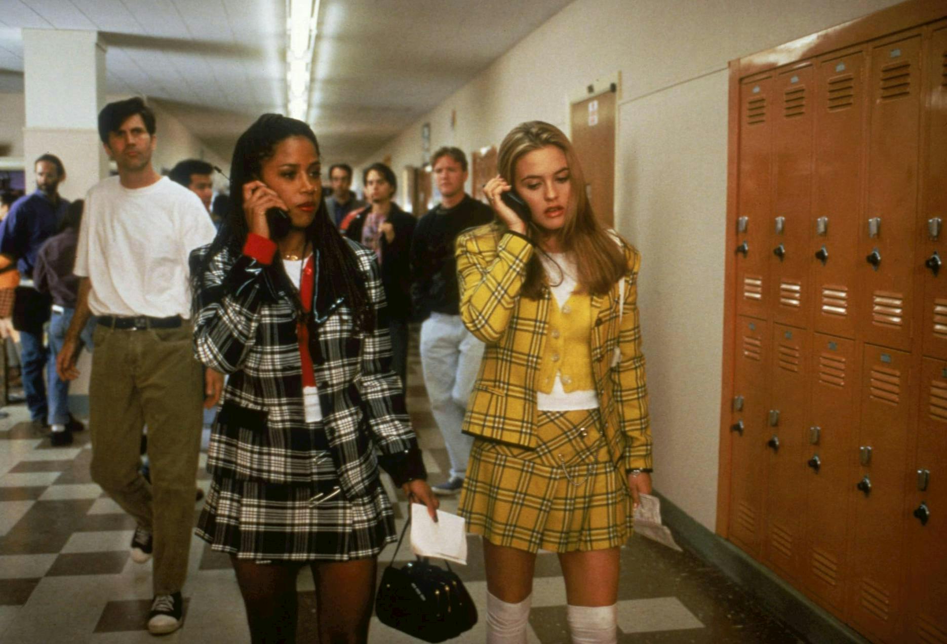 cher and dionne in plaid outfits in a still from clueless