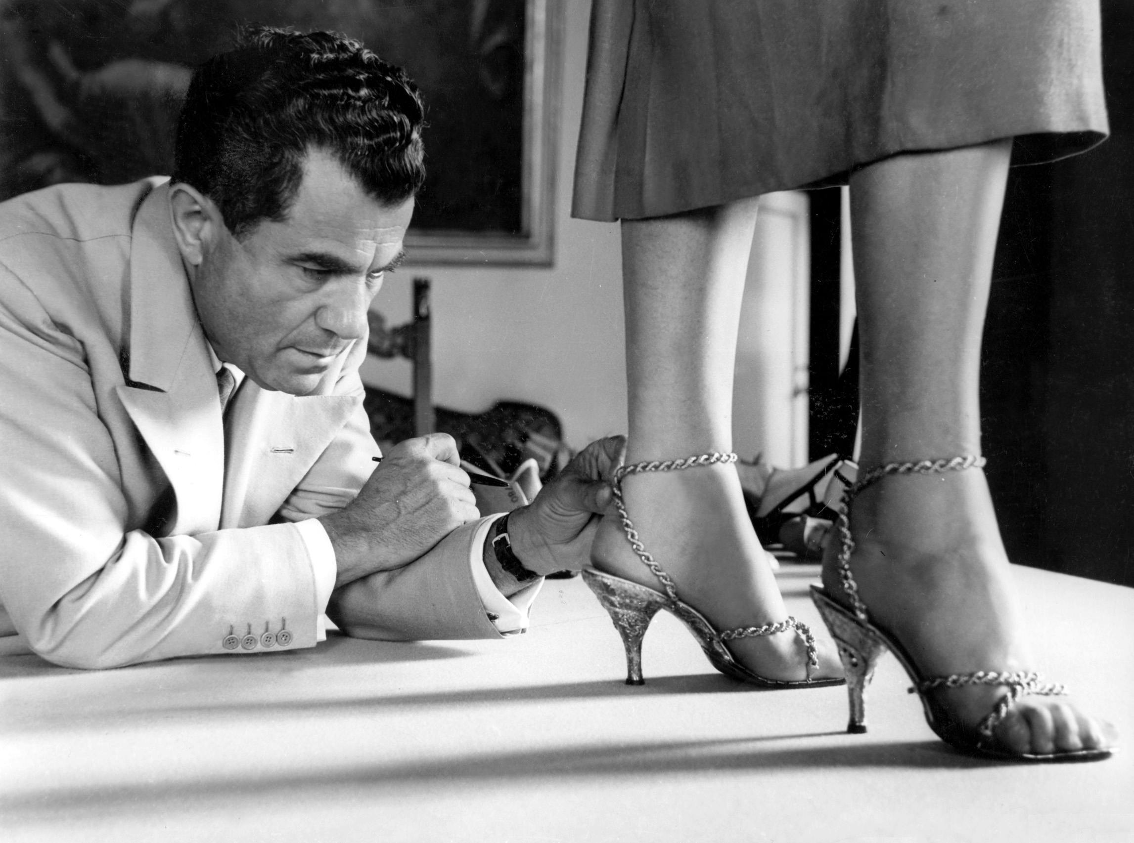 salvatore ferragamo looking at shoes he created