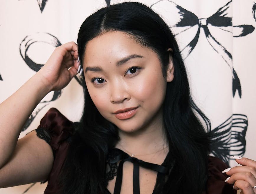 lana condor in a black lace dress with demi method makeup