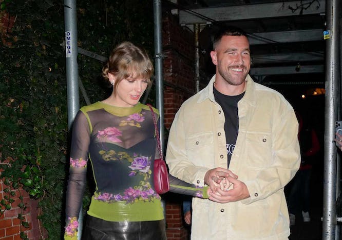 taylor swift in mesh top and mini skirt next to travis kelce