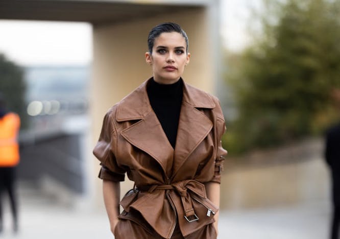 woman in brown leather jacket and leather skirt