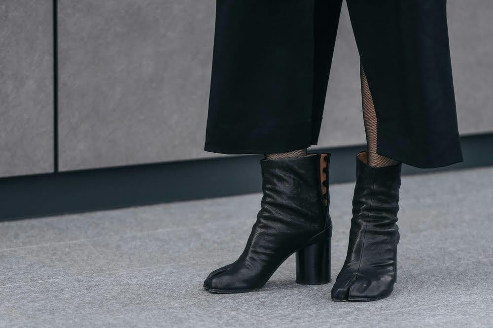 a pair of black tabi boots