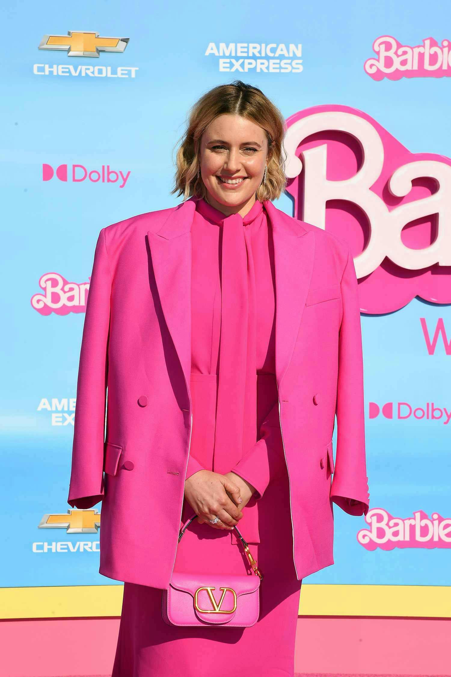 greta gerwig at the barbie premiere in a barbie pink blazer and dress