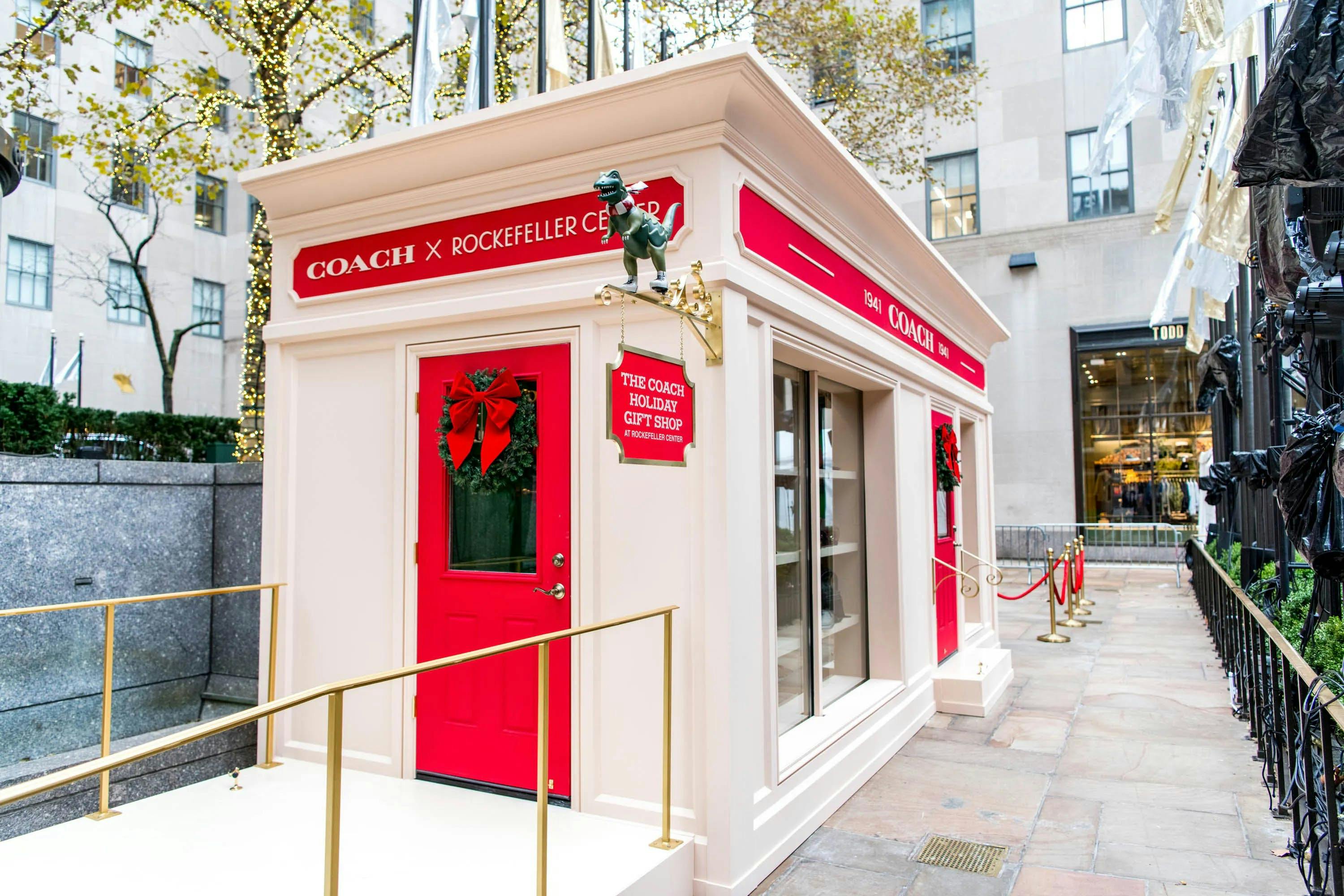 a small red and white building for coach x rockefeller holiday goft shop