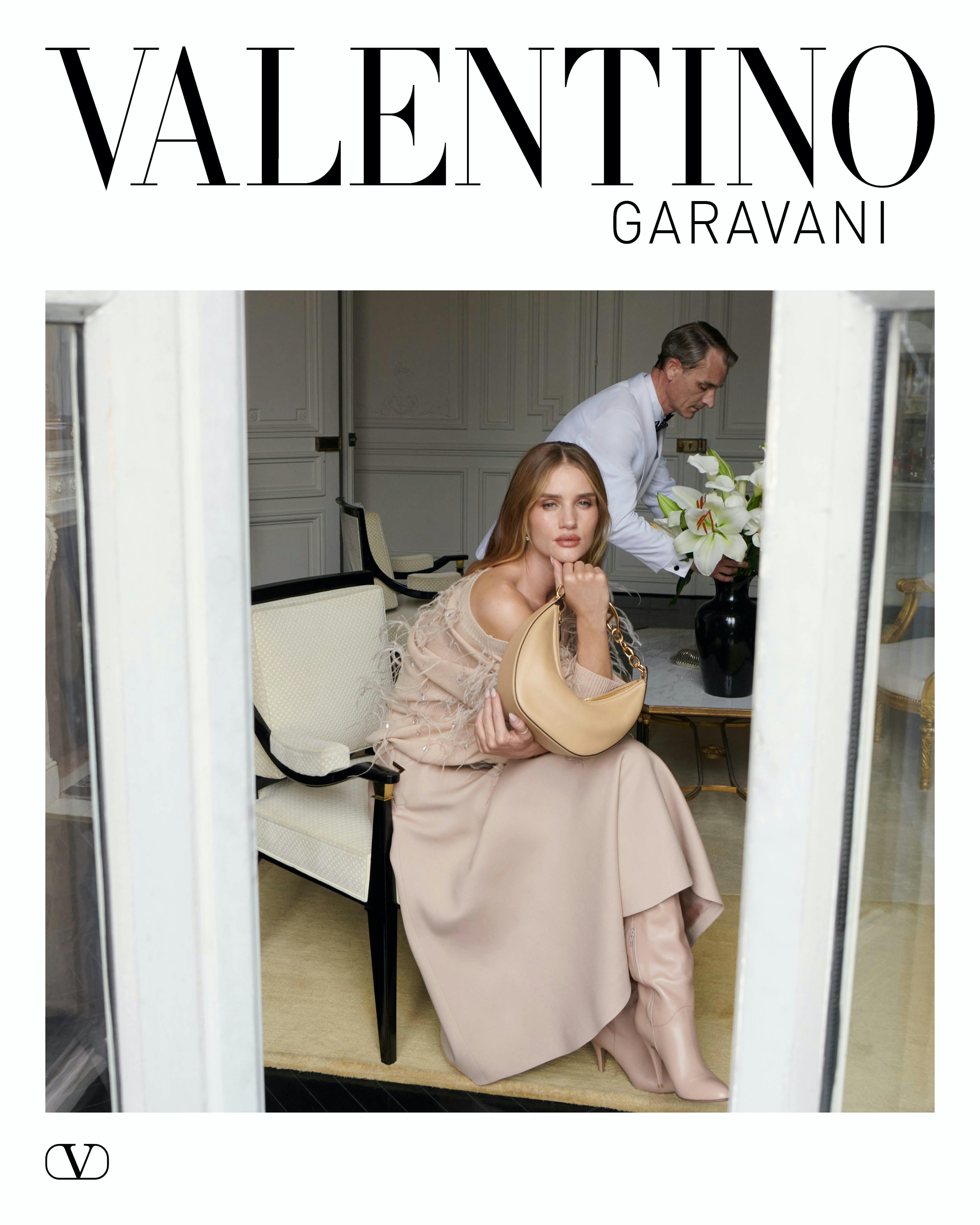 Rosie Huntington-Whiteley sitting in a nude colored flowy dress for a valentino campaign