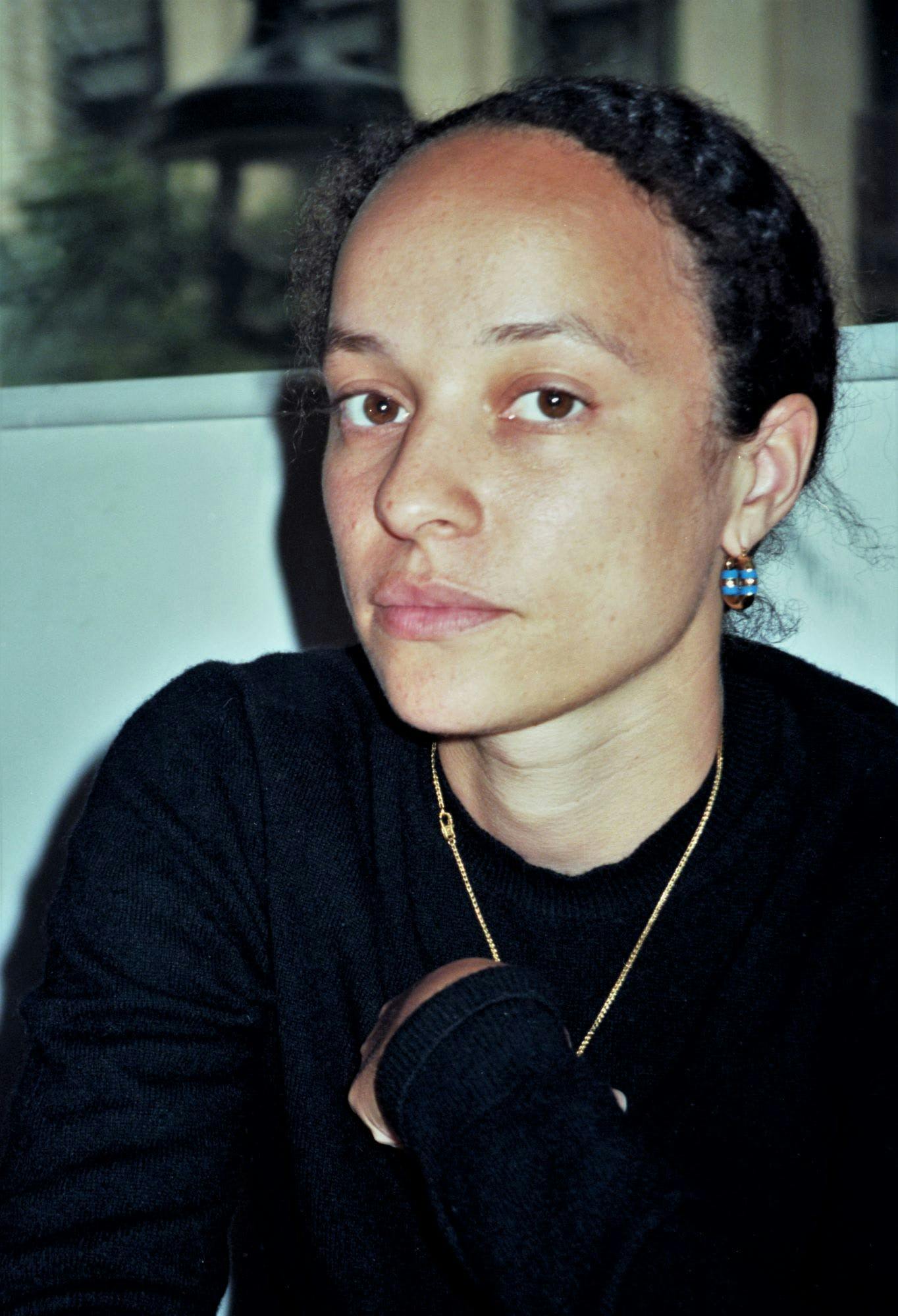 a photo of grace wales bonner in a black shirt looking at the camera