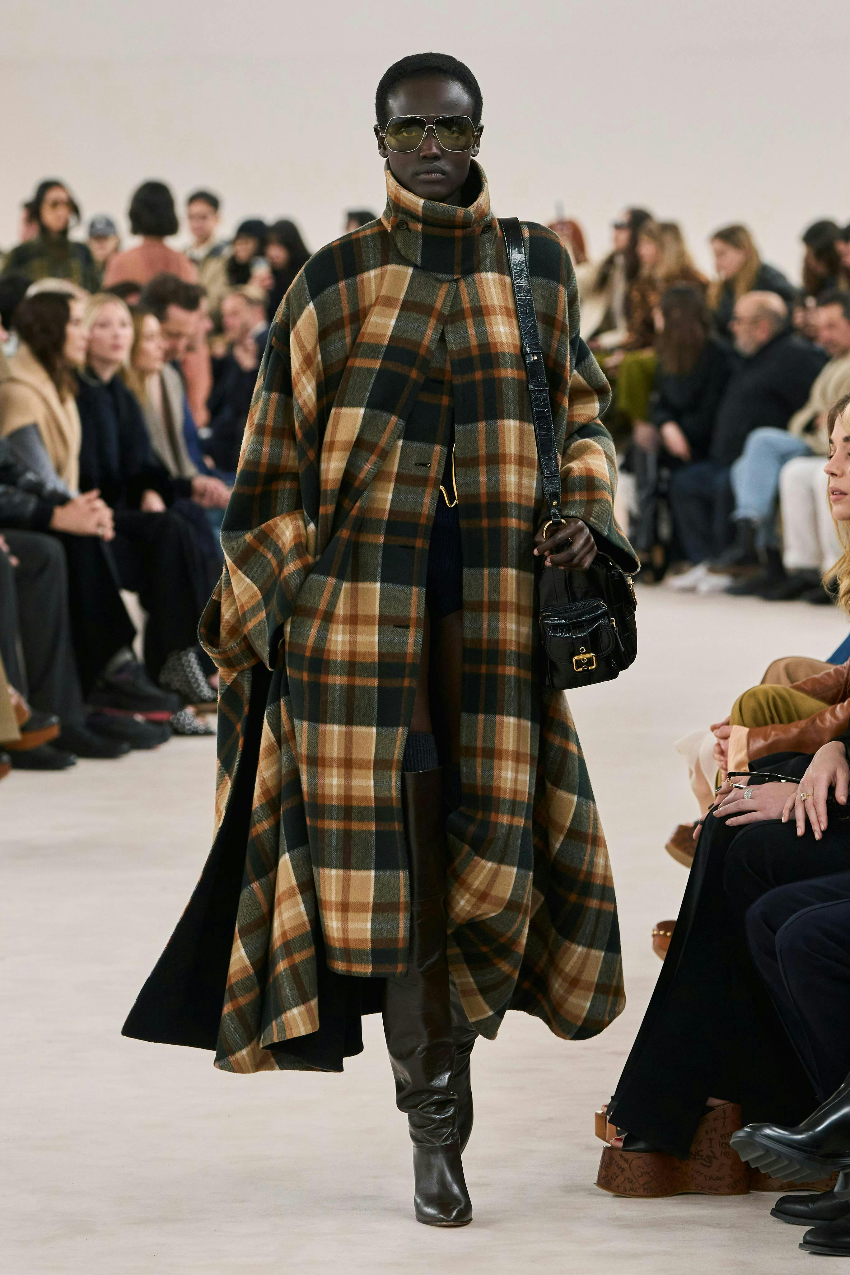 clothing coat fashion adult female person woman overcoat handbag face