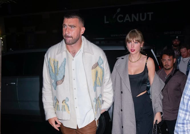 travis kelce and taylor swift holding hands; taylor swift outfits