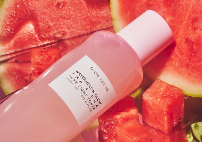 Glow Recipe Toner in a pink bottle with watermelons slices in the background.