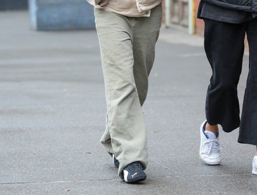240401ignt new york pedestrian person pants walking hoodie adult female woman coat jacket