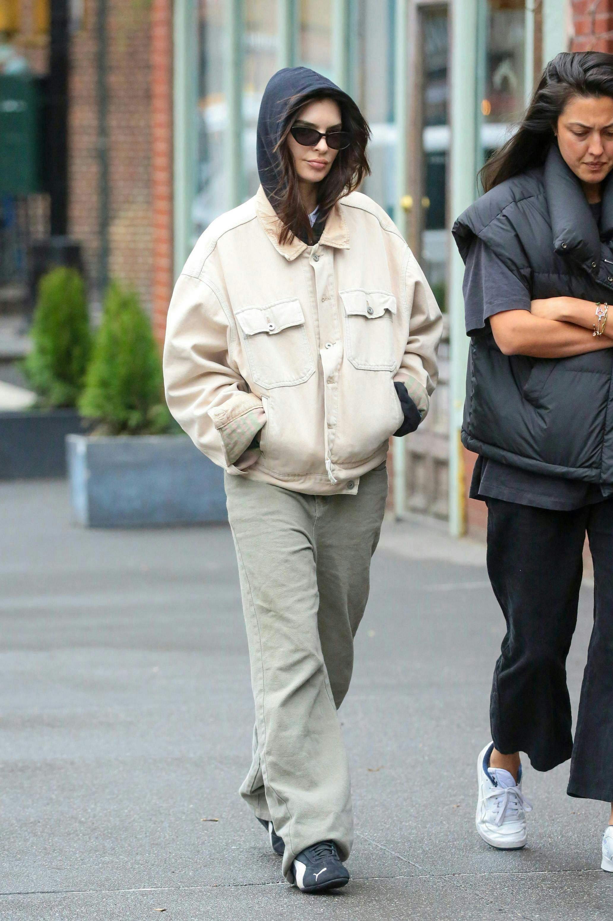 240401ignt new york pedestrian person pants walking hoodie adult female woman coat jacket