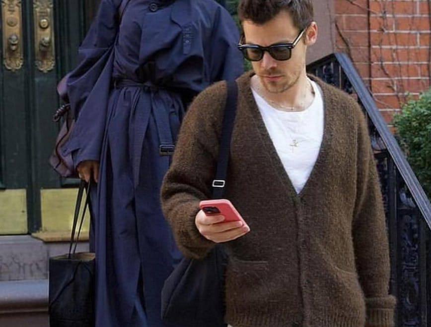 clothing coat knitwear sweater pedestrian person accessories bag handbag